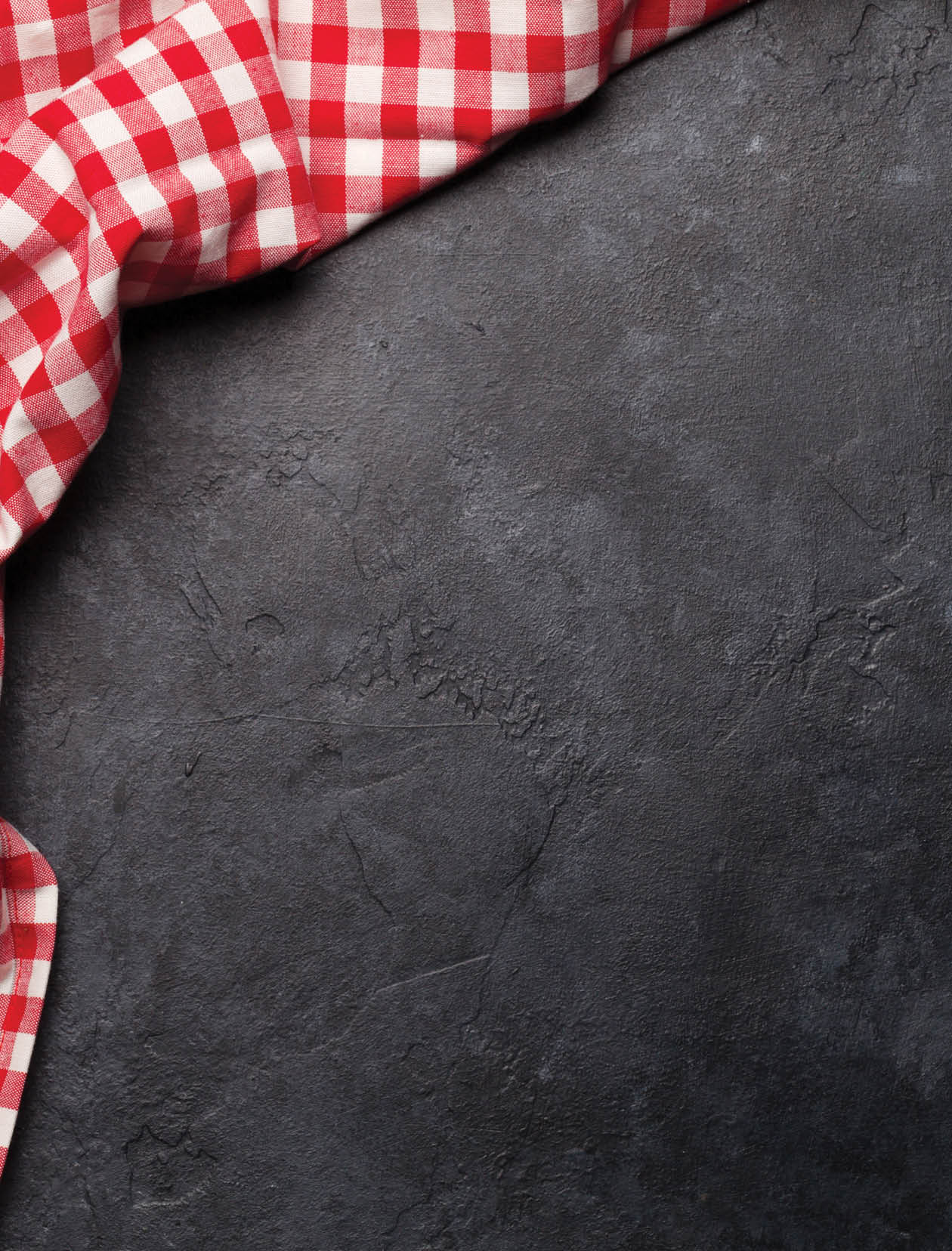 Kitchen table with tablecloth and space for your recipe or menu. Top view flat lay