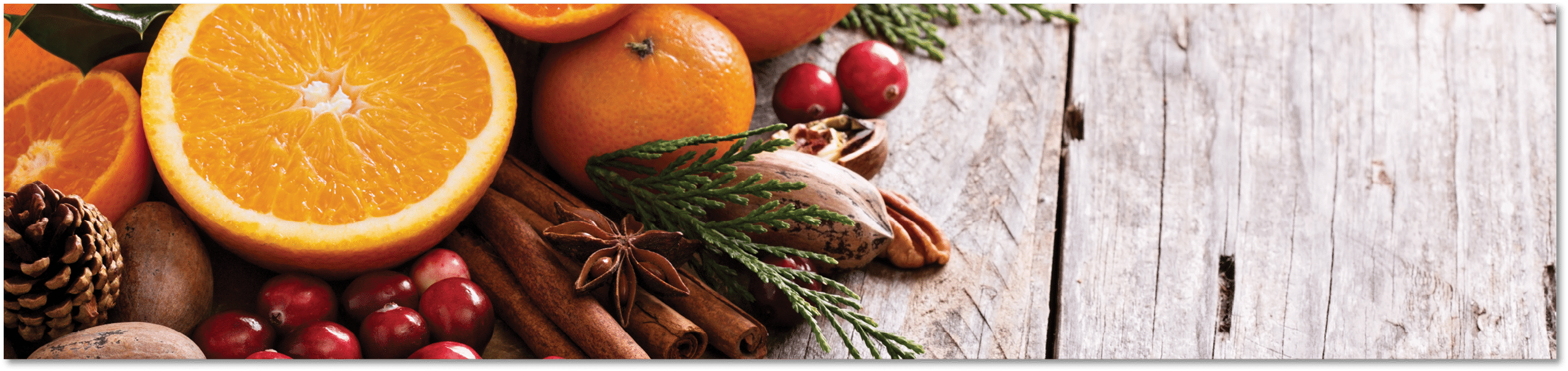 Fall and winter ingredients still life with oranges, cranberry, nuts and spices